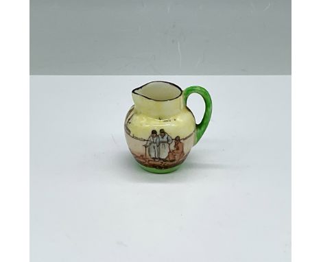 This hand-painted miniature pitcher is part of Royal Doulton Dutch Harlem Seriesware collection, designed by Charles Noke and