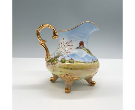 Exquisite hand-painted porcelain creamer signed by R Faulkner, featuring a vibrant desert landscape with cacti and a roadrunn