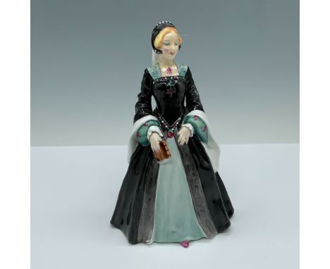 Handmade and hand decorated glossy figure of a woman modeling a black and seafoam combination dress with a matching headpiece
