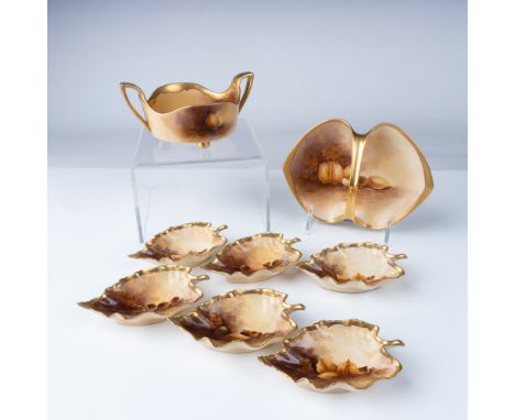 This exquisite 8-piece set of Pickard porcelain dishes features a hand-painted nut pattern, including six leaf-shaped nut dis