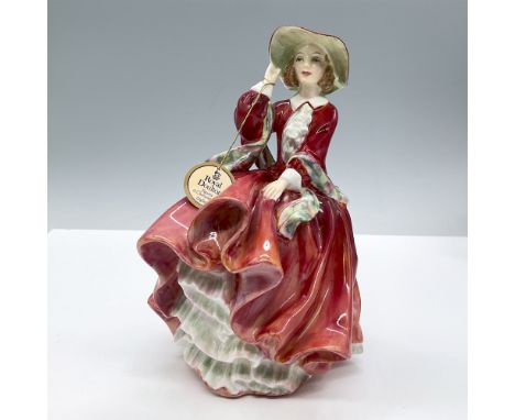 Modeled in a beautiful red dress with a colorful scarf. Royal Doulton backstamp. Artist: Leslie HarradineIssued: 1937 - 2004D