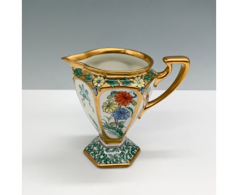 Exquisite Pickard China hand-painted creamer featuring a vibrant floral motif with gilt accents. This hexagonal-shaped piece 