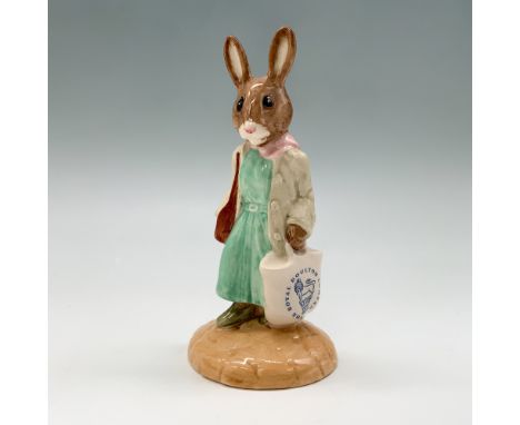 This charming Royal Doulton Bunnykins figurine, titled Shopper (DB233), features a delightful bunny dressed in a light green 