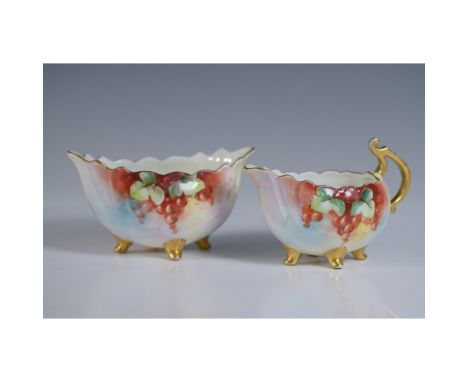 Elegant Vienna Austria porcelain cream and sugar set with hand-painted grape motif. The set features red grapes, green leaves