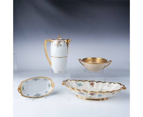 A collection of four Pickard porcelain serving pieces featuring elegant hand-painted designs and gold accents. This lot inclu