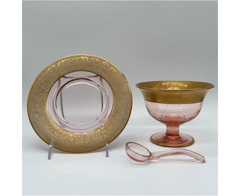 A refined pink glass dessert set comprising a footed dessert bowl, matching underplate, and a delicate ladle. This set featur