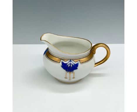 A stunning Pickard China hand-painted porcelain creamer featuring an intricate blue floral motif in an Art Deco style, comple