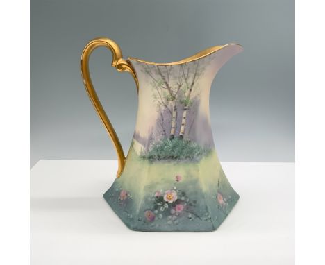 A striking handpainted Pickard china pitcher featuring a serene landscape design with birch trees and blooming flowers, compl