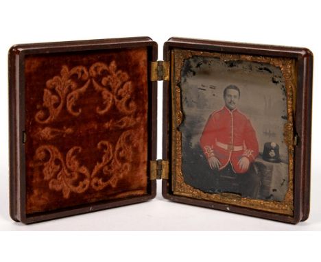 19TH CENTURY PHOTOGRAPHY. A THERMOPLASTIC UNION CASE OF FLOWER AND GRAPEVINE DESIGN, CONTAINING A CONTEMPORARY PAINTED AMBROT