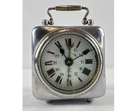 An antique wind up bedside alarm clock with enamelled face and bevel edged glass. A small silver plated cube shaped clock wit