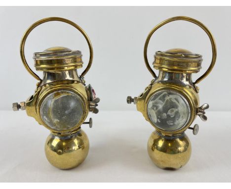 A pair of 1920's Sherwood Linley Ltd brass oil powered automobile lamps. Named to wick winders and ceramic burners. With unde