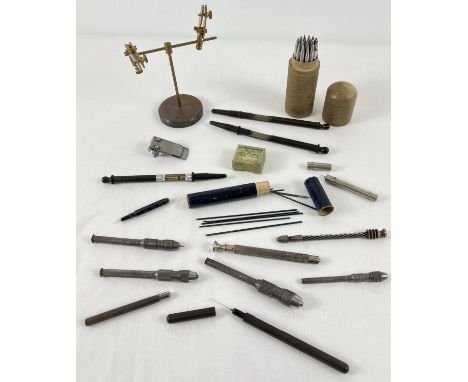 A collection of vintage watch makers tools. To include a French brass Helping Hands stand, drill handles, punching tools, gau
