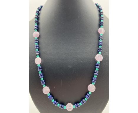 A 22" beaded necklace made from amethyst, turquoise and lapis lazuli beads. With silver tone T bar clasp. Retired jewellery m