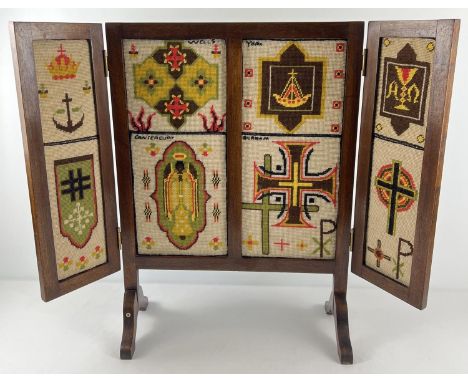 A vintage dark wood folding screen with embroidered tapestry panels. Approx. 68cm tall x 50cm wide (folded). 