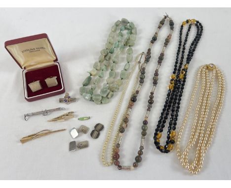 A collection of assorted vintage costume jewellery items. To include: natural stone and glass bead necklaces, tie pins, silve