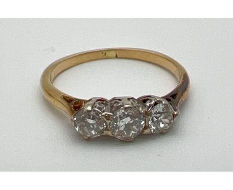 A vintage 18ct gold .60ct diamond trilogy ring. Worn marks to inside of band but tests as 18ct. Ring size K, total weight app