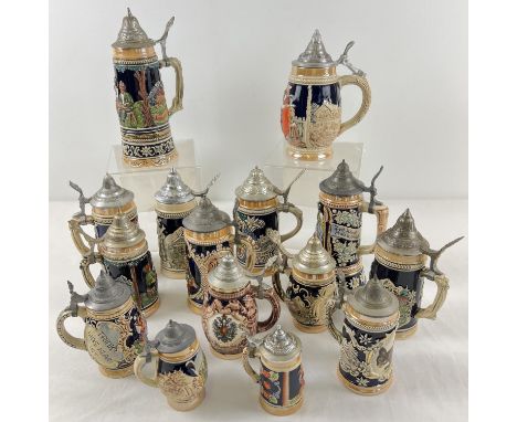 A collection of 15 assorted ceramic steins with hinged metal lids, to include musical examples. In varying designs and sizes.