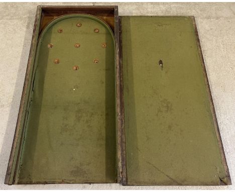 An large wooden Edwardian bagatelle table with green baize interior. In need of restoration. Total length opened approx. 244 