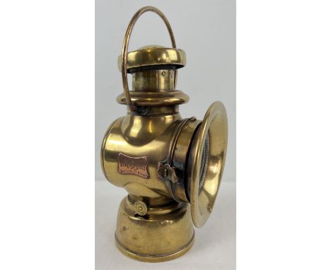 An Edwardian era Joseph Lucas Ltd King of the Road No. 754 oil powered motor car side lamp. Polished brass finish, named to c