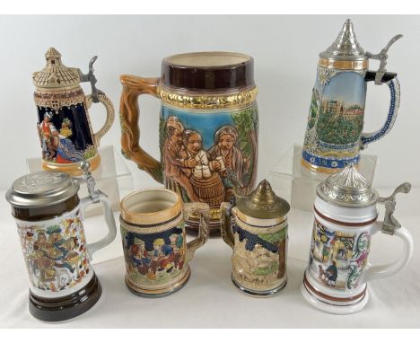 A very large ornamental ceramic stein together with 6 other smaller assorted steins. Largest approx. 32cm tall. 