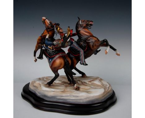 Hand painted and highly detailed porcelain figurine grouping. Captain Kelly, First Life Guards cavalry regiment engaging the 