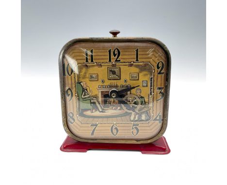 A pressed tin frame painted red with an art deco-style color litho dial depicting a domestic scene. It features an animated s