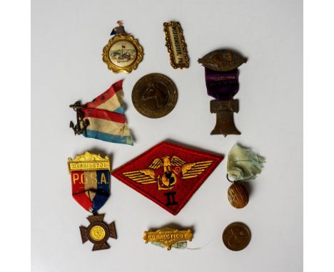 This collection includes a nutmeg medal from Connecticut, a souvenir medal from Fort Fisher, a ribbon topper pin from Westche