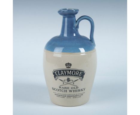 Classic ceramic whisky bottle with Claymore label on front and decorated with light blue glaze over ceramic. Dimensions: 9"H 