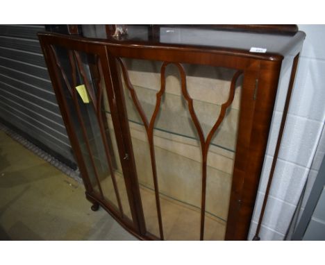 An art deco glass fronted display case