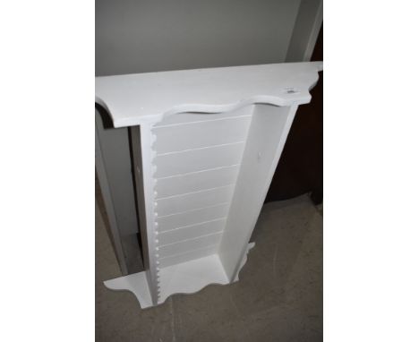 A painted pine storage shelf or delft rack