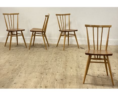 Ercol, a set of four beech and elm comb back dining chairs, each with gold label verso. H80cm.&nbsp;