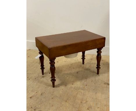 A Victorian mahogany commode, the lift off lid opening to a turned wood and ceramic liner, raised on turned and tapered suppo