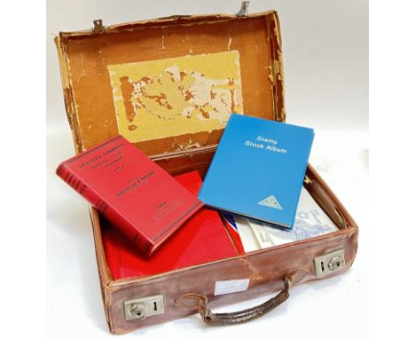 A vintage leather suitcase containing various stamps including KG6 Ceylon, L.M.M, North Borneo 1945, various light mounted UK