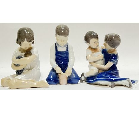 A group of three ceramic figural groups comprising a Royal Copenhagen mother and child (h- 12cm, w- 11.5cm), a Royal Copenhag