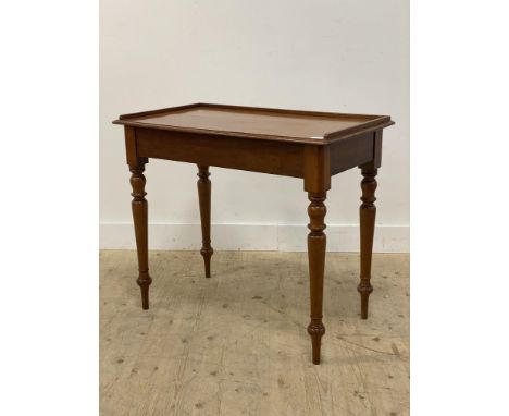 A Victorian mahogany console table, the top with 3/4 gallery, raised on turned and tapered supports. H80cm, W92cm.&nbsp;