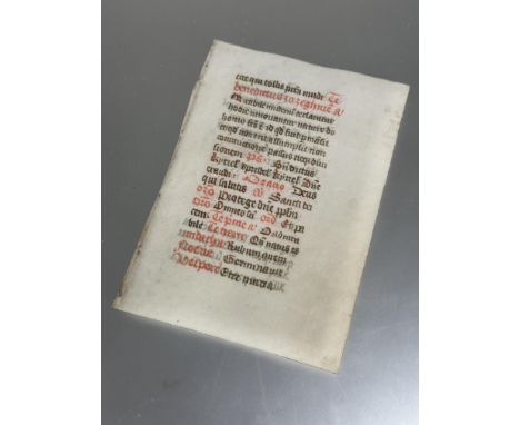 An antique vellum (possibly medieval) manuscript leaf, probably from the book of Hours (h- 12cm, w- 8.5cm)