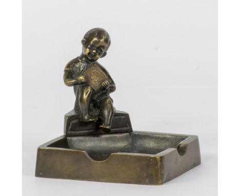 Geo VINDEVOGEL (1923-1977), bronze sculpture of a young boy mounted on a bronze ashtray carrying a bronze coin Geo VerbanckGe