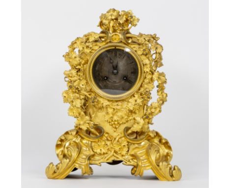 Beautiful ormolu Louis XV style mantle clock with rich decoration of gilt leaves, vines and flowers. Marked Leroy &amp; Fils,