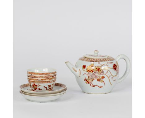 A porcelain teapot and its cover, with four cups and three saucers of similar design, finely painted in iron red and gold to 
