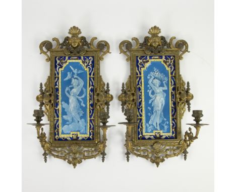 Exceptional pair of early French bronze wall lights in neoclassical style with symmetrical decoration of shell motifs and flo