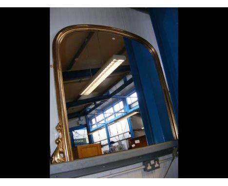 A large gilt framed overmantel mirror 