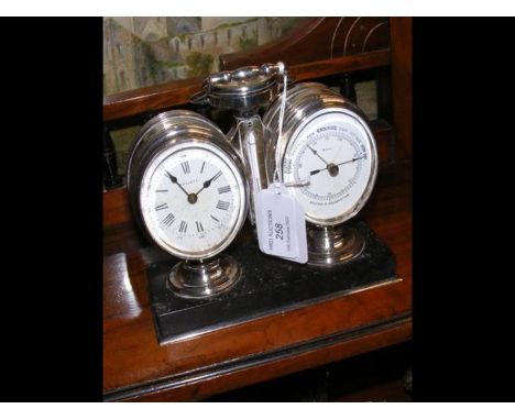 An antique desk clock barometer/thermometer set with compass to the top in silver plated surround - 14cms highCONDITION REPOR