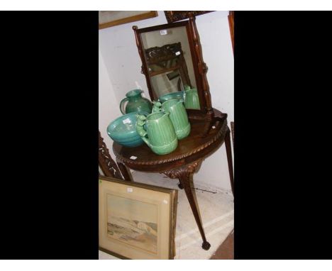 A circular antique occasional table together with a toilet mirror