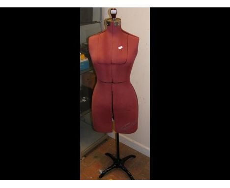 A vintage dressmaker's dummy on metal stand 