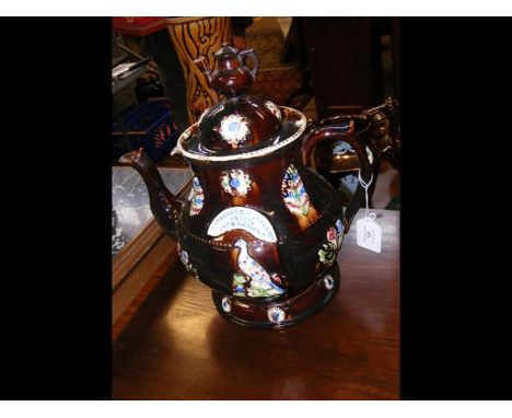 A 32cm high Bargeman's teapot on stand 