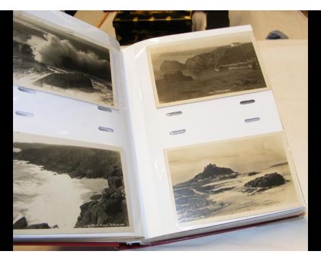 An album bearing vintage monochrome postcards relating to Cornwall