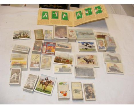A box containing vintage cigarette cards (approx. 30 packs)