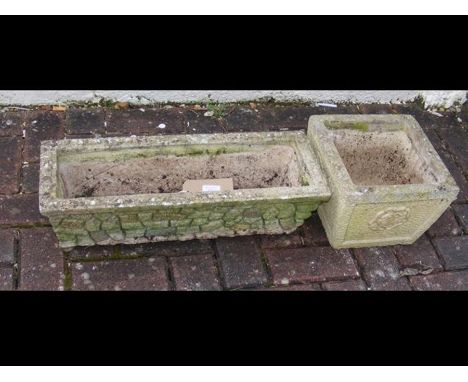 A rectangular stoneware trough and square planter