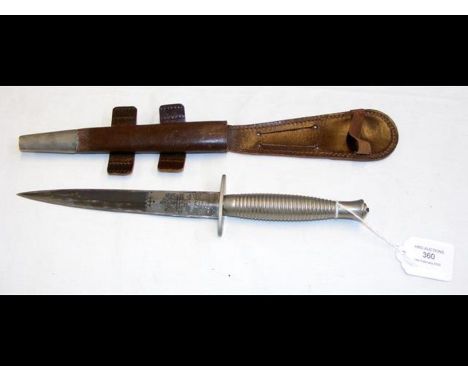 A British Fairbairn Sykes commando knife with leather scabbard by WilkinsonCONDITION REPORT.