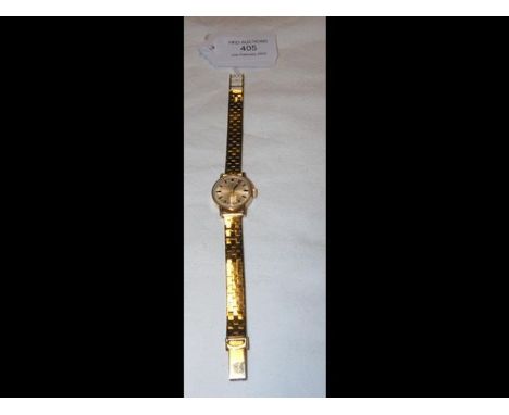 A 9ct gold Tissot watch and strap 